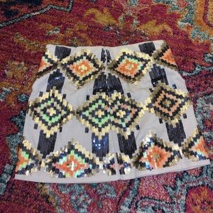 White miniskirt with colorful sequin design